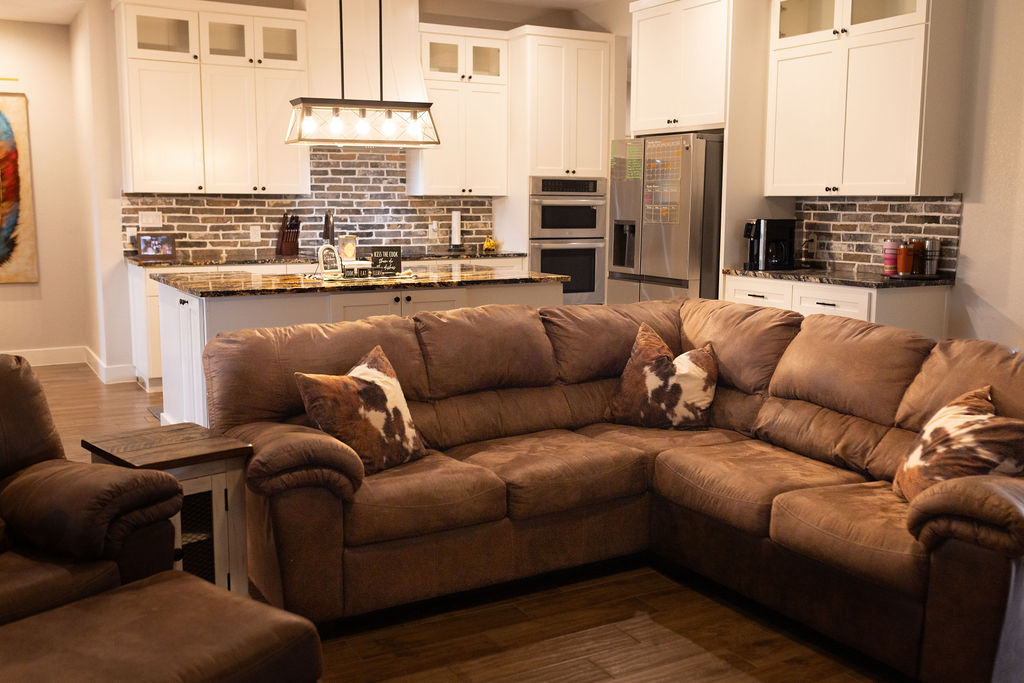 111 Powder Ridge Luling, TX 78648 - Photo 21 of 22 An open concept design seamlessly connects the kitchen and living area, perfect for entertaining.
