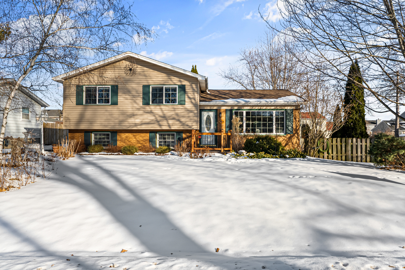 325 Hillandale Street Round Lake, IL 60073 - Photo 1 of 31 a front view of a house with a yard