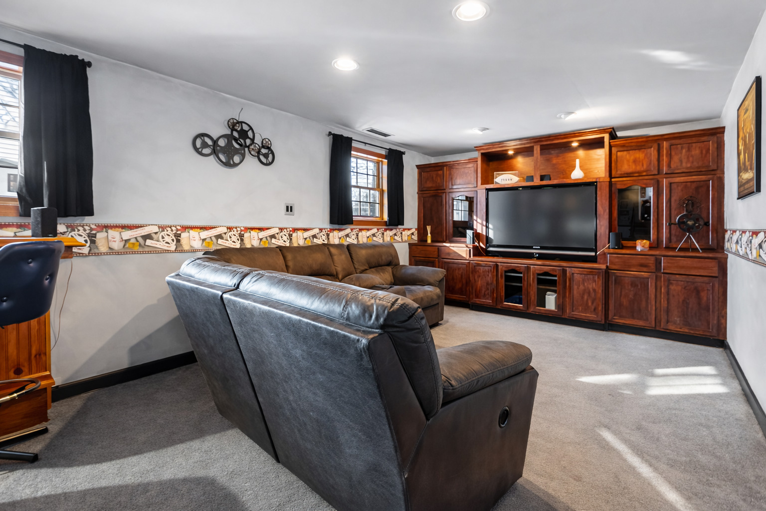 325 Hillandale Street Round Lake, IL 60073 - Photo 18 of 31 a living room with furniture and a flat screen tv