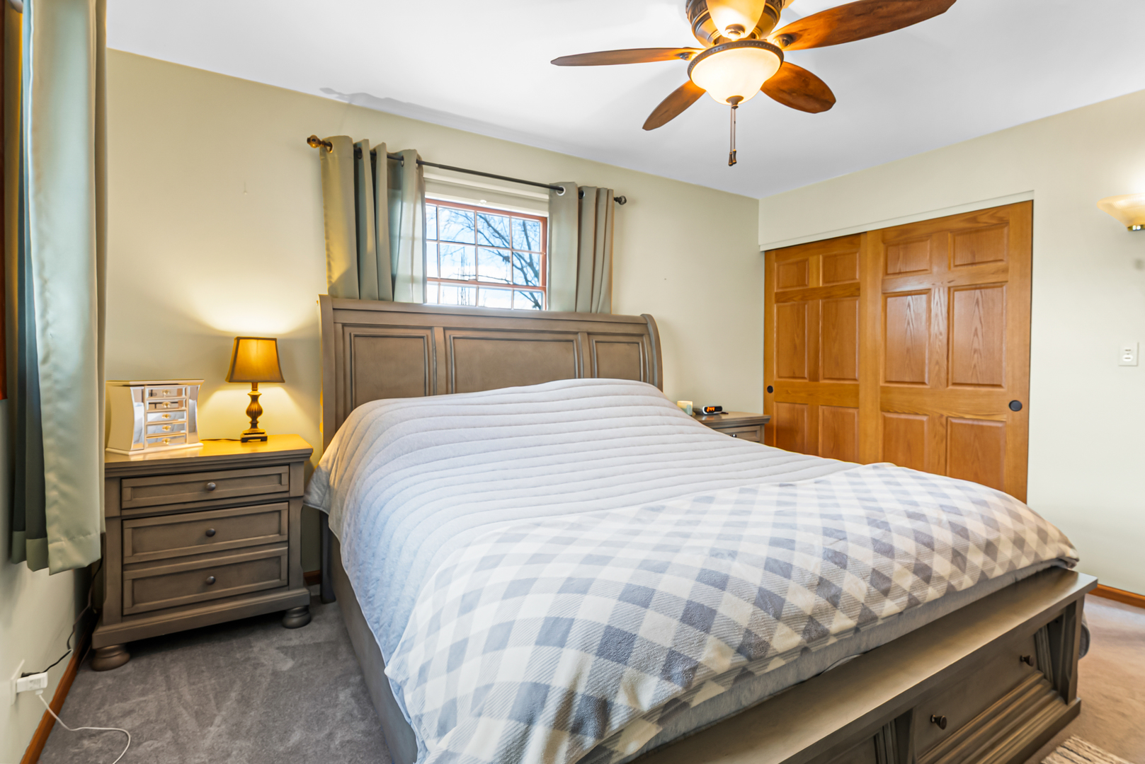 325 Hillandale Street Round Lake, IL 60073 - Photo 10 of 31 a bedroom with a bed and a chandelier