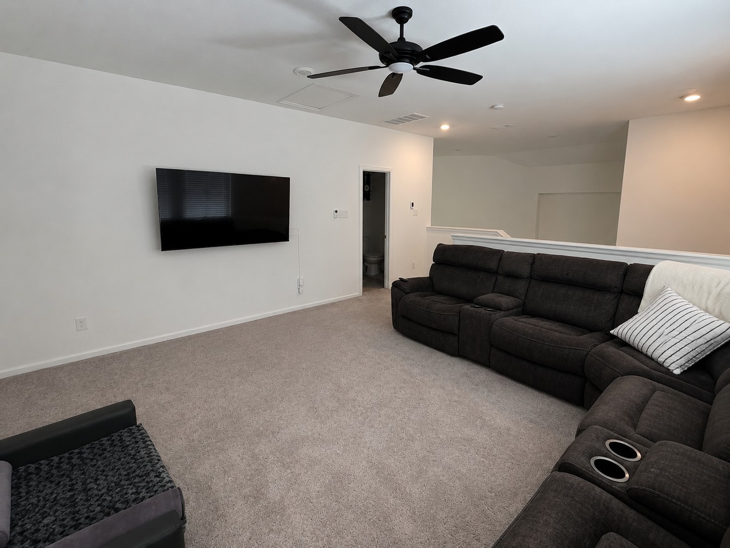 5035 Sierra Ridge Drive Rosenberg, TX 77469 - Photo 20 of 26 Discover the ultimate entertainment hub with this spacious upstairs game room, perfect for family fun and relaxation.