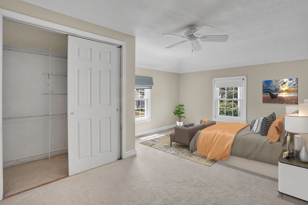 27 Oregon Street Springfield, MA 01118 - Photo 22 of 42 a living room with a bed furniture and a window