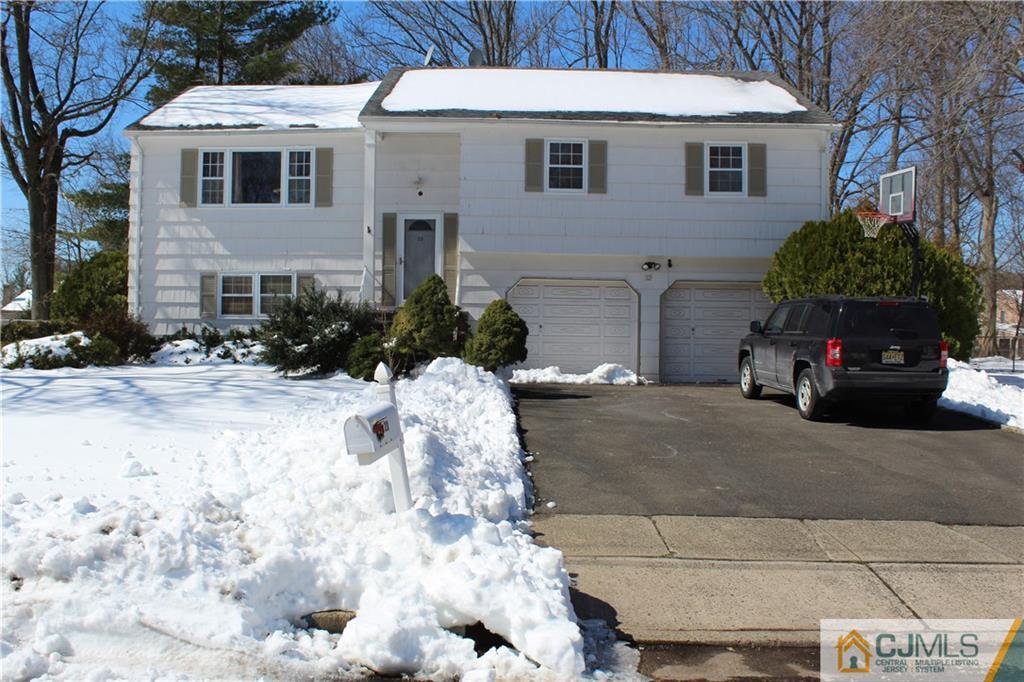 23 Hilltop Road Edison, NJ 08820 - Photo 1 of 17 a view of a white house with a yard