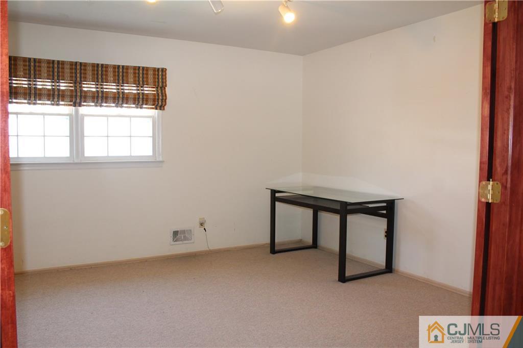 23 Hilltop Road Edison, NJ 08820 - Photo 14 of 17 a view of an empty room with a window