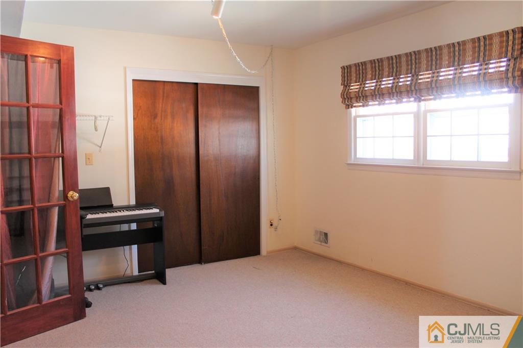 23 Hilltop Road Edison, NJ 08820 - Photo 15 of 17 an empty room with windows