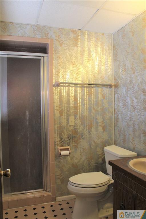 23 Hilltop Road Edison, NJ 08820 - Photo 16 of 17 a bathroom with a sink a toilet a shower and a window