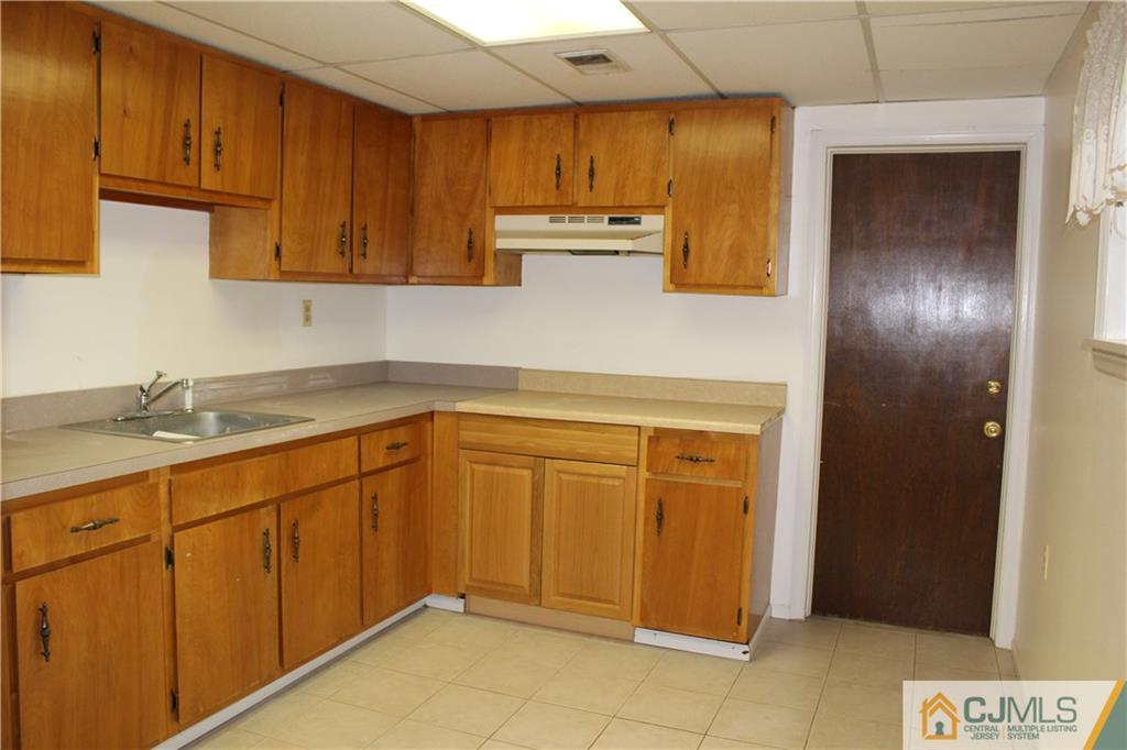 23 Hilltop Road Edison, NJ 08820 - Photo 17 of 17 a kitchen with stainless steel appliances granite countertop a sink and cabinets