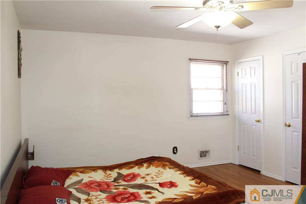 23 Hilltop Road Edison, NJ 08820 - Photo 9 of 17 a bedroom with a bed and a window