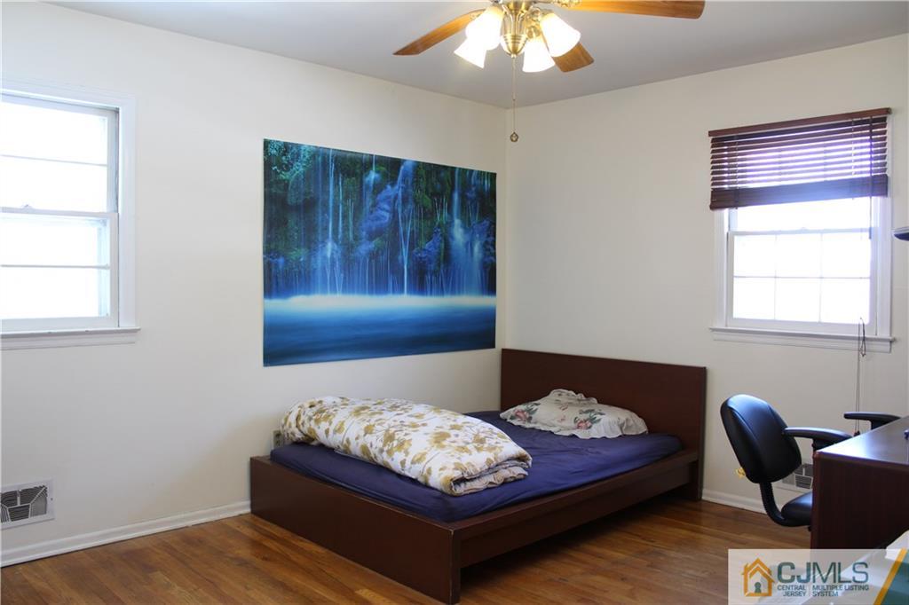 23 Hilltop Road Edison, NJ 08820 - Photo 10 of 17 a bedroom with a bed and window
