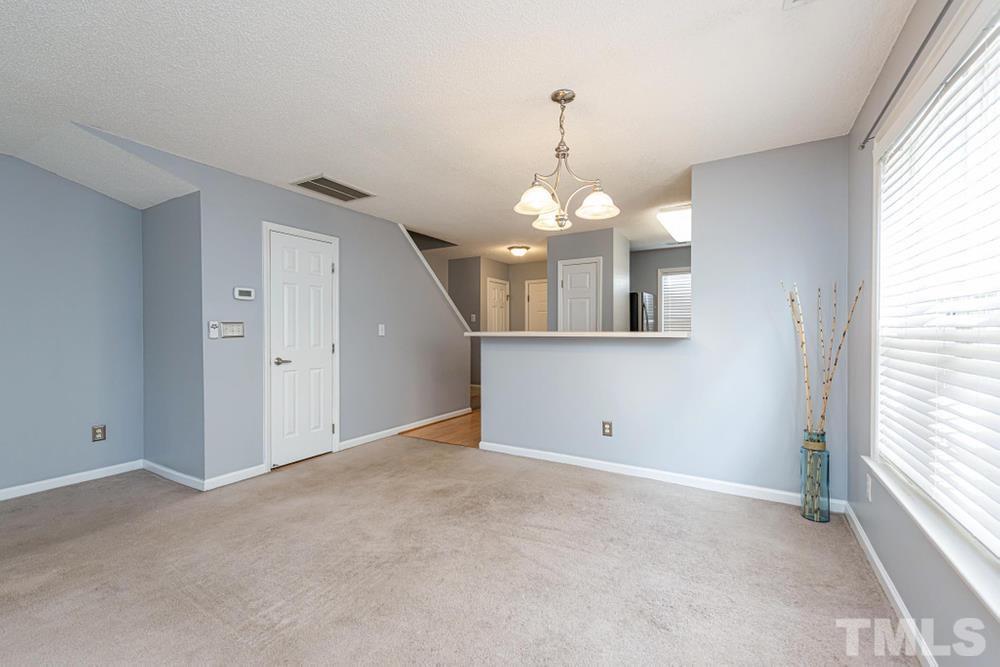 2118 Turtle Point Drive Raleigh, NC 27604 - Photo 5 of 30 Door leads to half bath with pedestal sink.