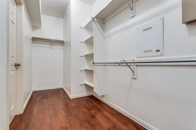a view of a room with wooden floor