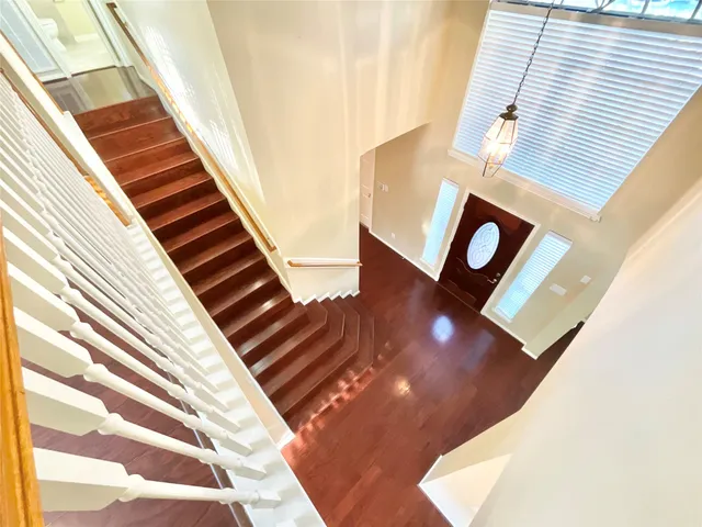 a view of an entryway with wooden floor