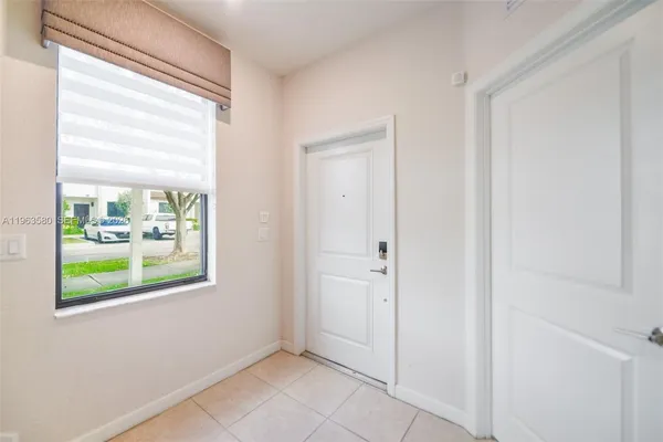a view of an entryway with wooden floor