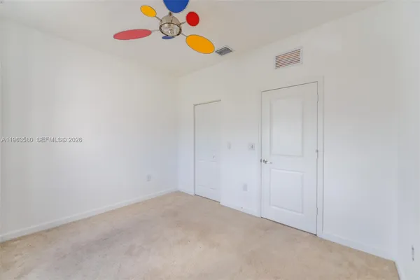 a view of an empty walk in closet