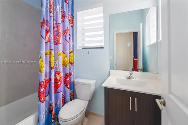 a view of a storage and utility room with a washer dryer