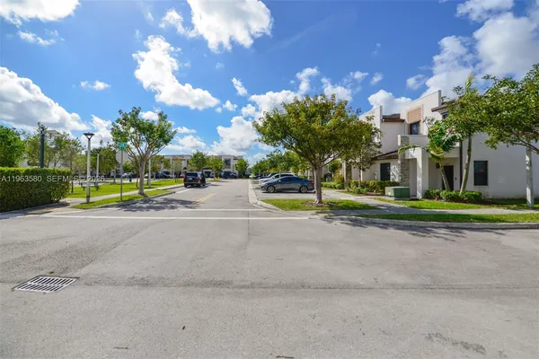 a view of a house with swimming pool and sitting area