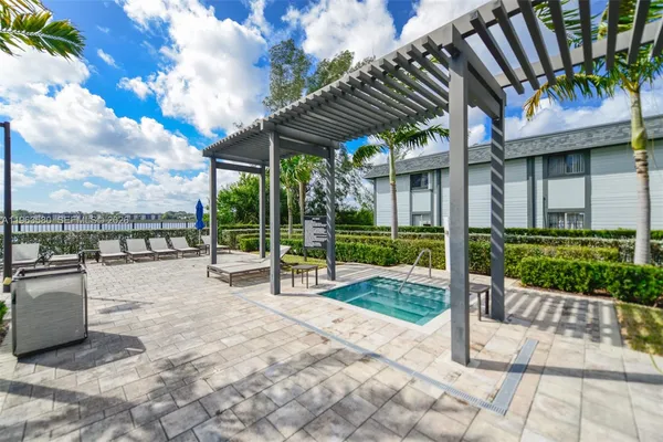 a view of a backyard with a patio