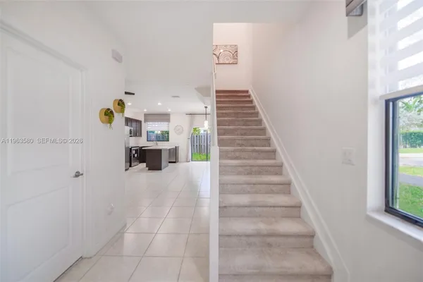 a view of entryway and workspace