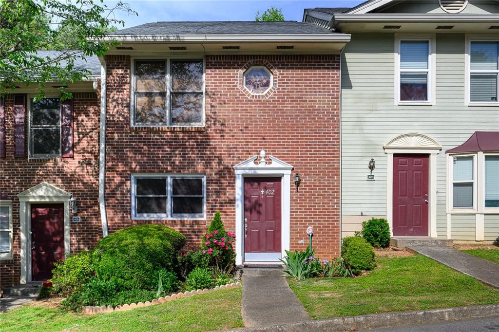 402 Autumn Leaf Way Norcross, GA 30093 - Photo 1 of 1 a front view of a house with garden
