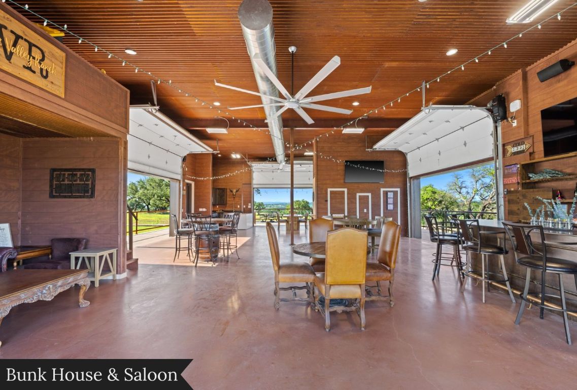 0 Gibson-Best Road Hye, TX 78635 - Photo 13 of 40 a dining room with furniture a floor to ceiling window and chairs