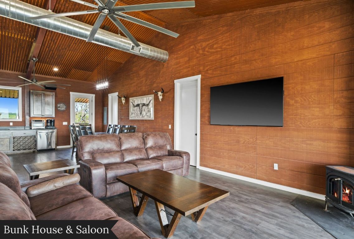 0 Gibson-Best Road Hye, TX 78635 - Photo 16 of 40 a living room with couches and a table with potted plants
