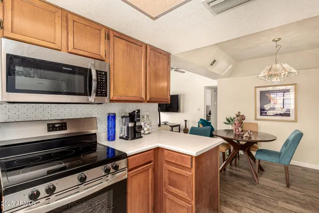a kitchen with a stove and a microwave