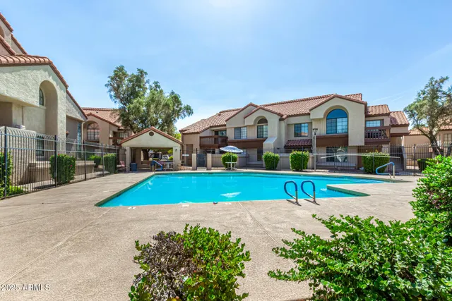 a view of house with outdoor space and sitting area
