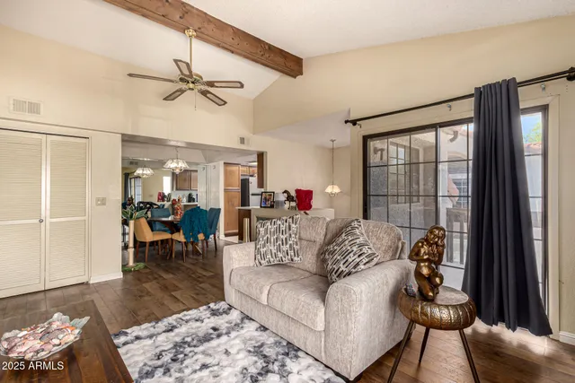 a living room with furniture and a window
