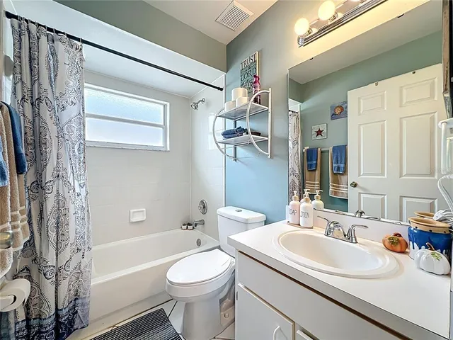 a bathroom with a sink a toilet and a bathtub