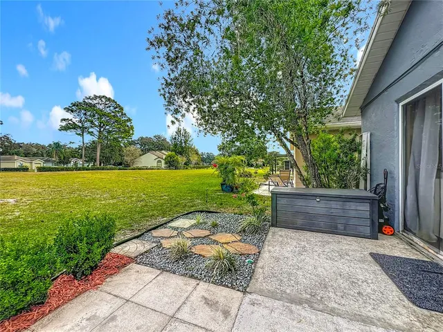 a view of a garden with an outdoor space