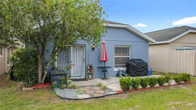 a house view with a backyard space