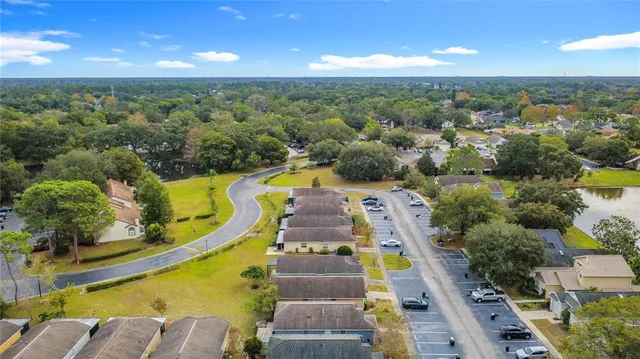 a view of a swimming pool with outdoor seating and yard