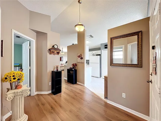 a view of a living room and a wooden floor