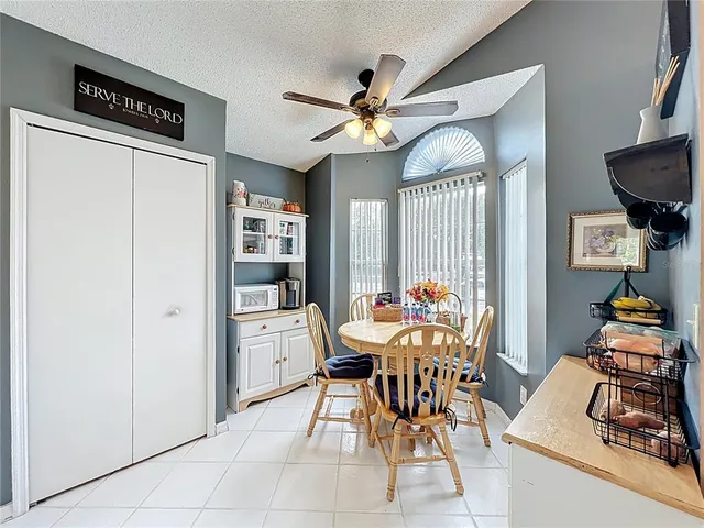 a dining room with furniture and window