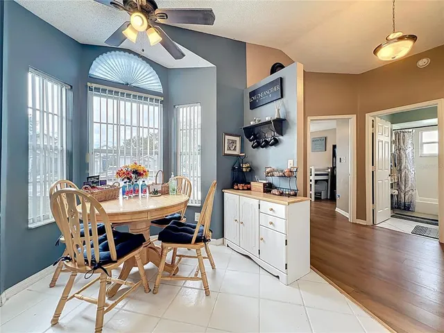a dining room with furniture and window