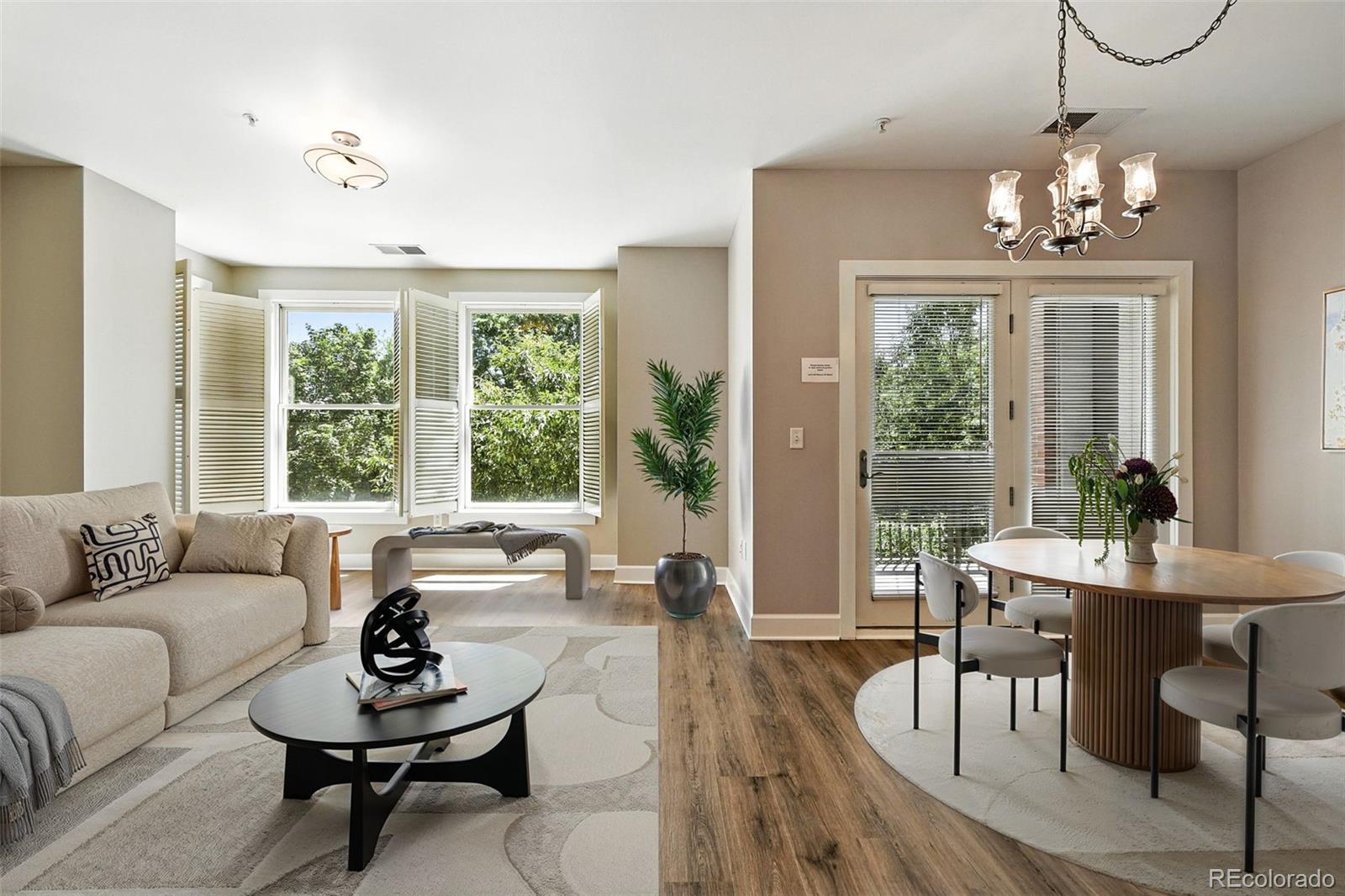 1631 Emerson Street, Unit 207 Denver, CO 80218 - Photo 6 of 31 a living room with furniture and a large window