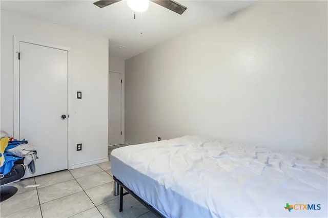 a bathroom with a sink toilet vanity tub and shower