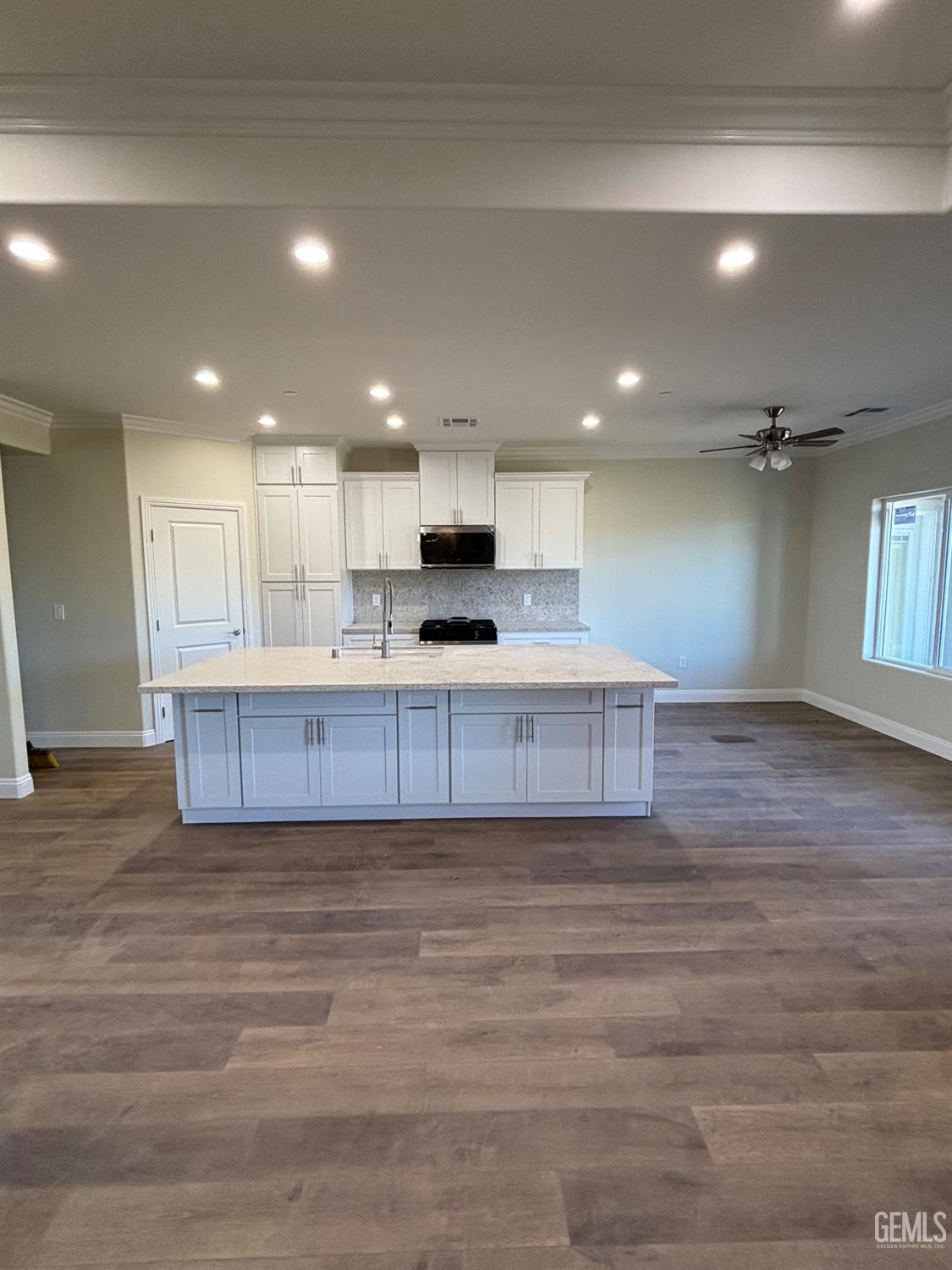 Undisclosed Address Tehachapi, CA 93561 - Photo 7 of 15 a view of kitchen with kitchen island stainless steel appliances refrigerator stove and cabinets