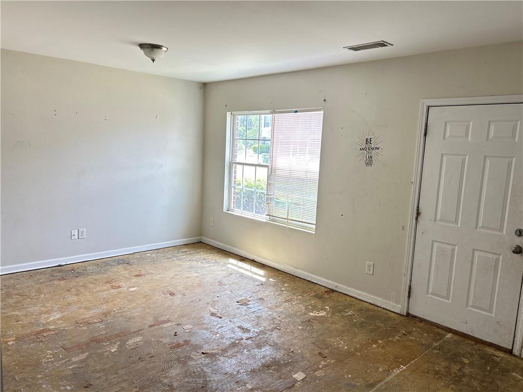 630 Mill Stone Bluff, Unit B Monroe, GA 30655 - Photo 3 of 14 a view of an empty room with a window