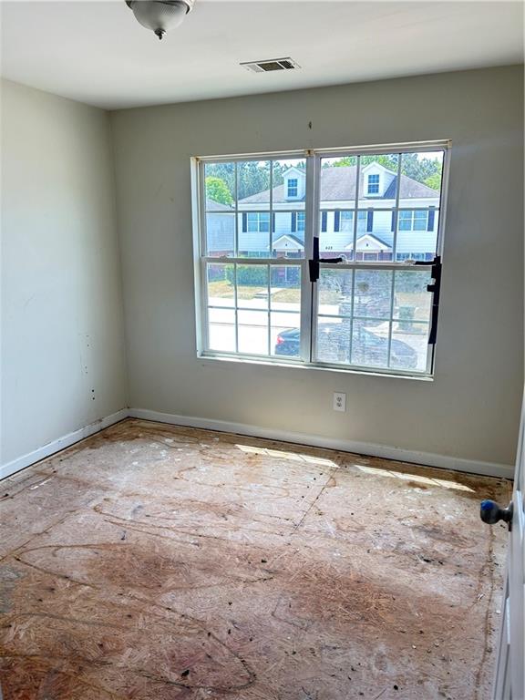 630 Mill Stone Bluff, Unit B Monroe, GA 30655 - Photo 10 of 14 a view of an empty room with a window