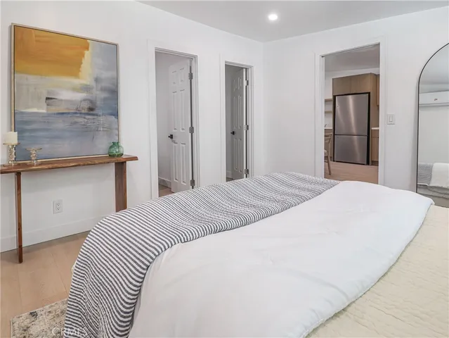 a large white bed in a white room