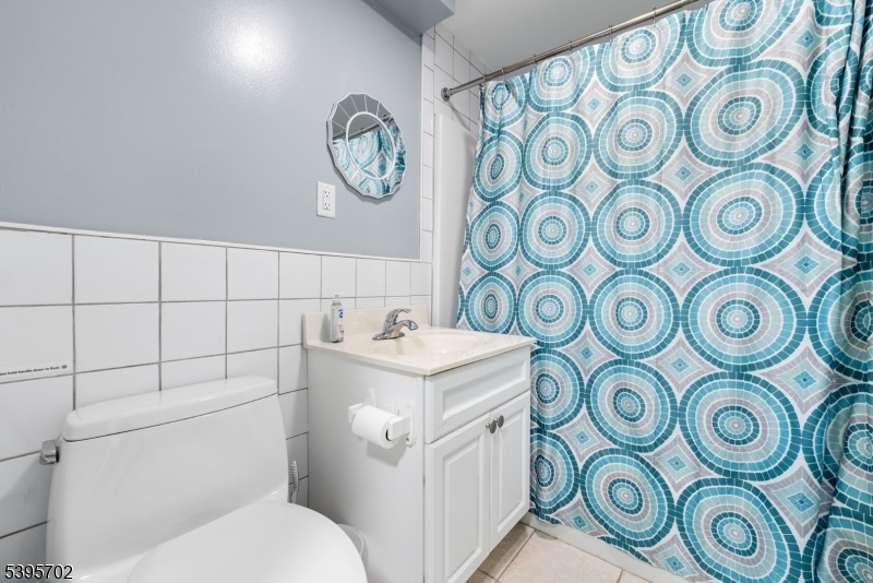 15 7th Avenue Seaside Heights, NJ 08751 - Photo 18 of 27 a bathroom with a toilet and a sink