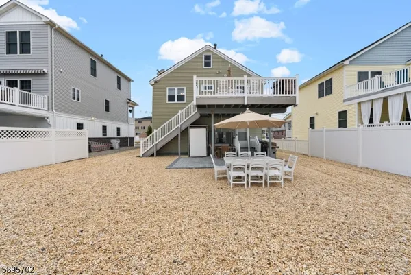 a dining room with furniture and a wooden floor