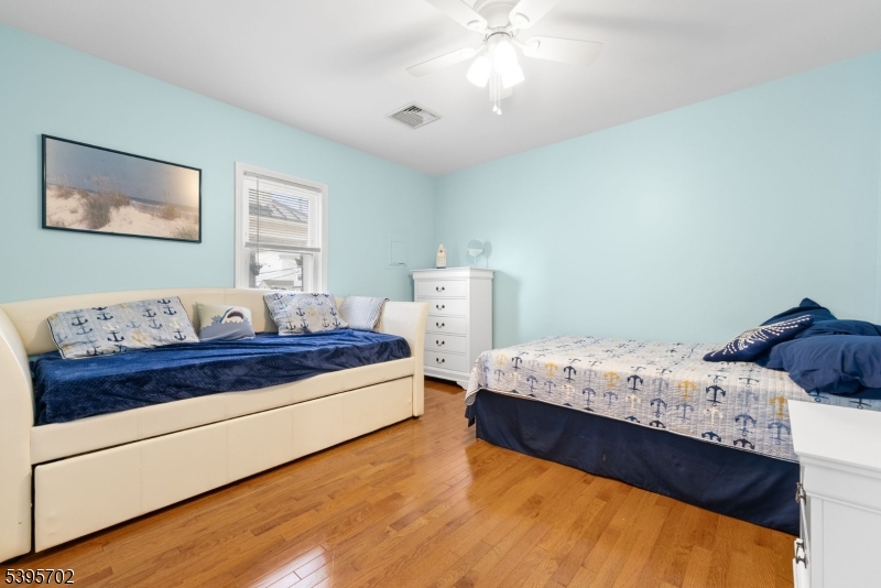 15 7th Avenue Seaside Heights, NJ 08751 - Photo 5 of 27 a bedroom with a bed and window