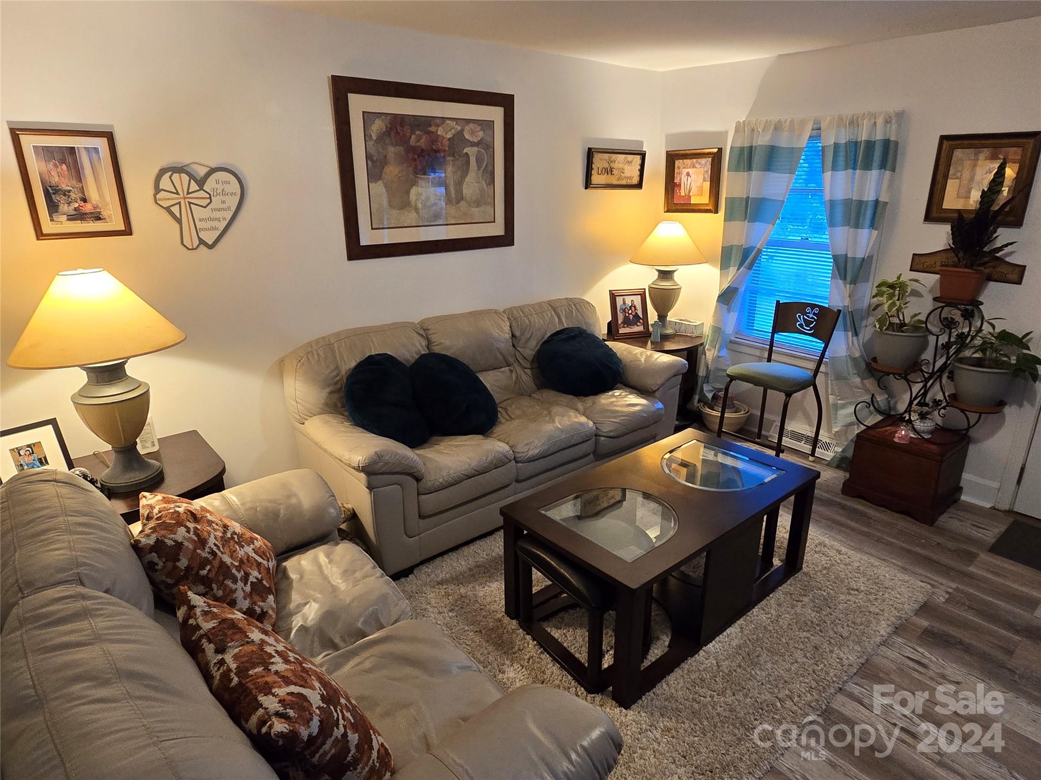 206 Fallen Oaks Lane Rutherfordton, NC 28139 - Photo 19 of 26 a living room with furniture and a lamp