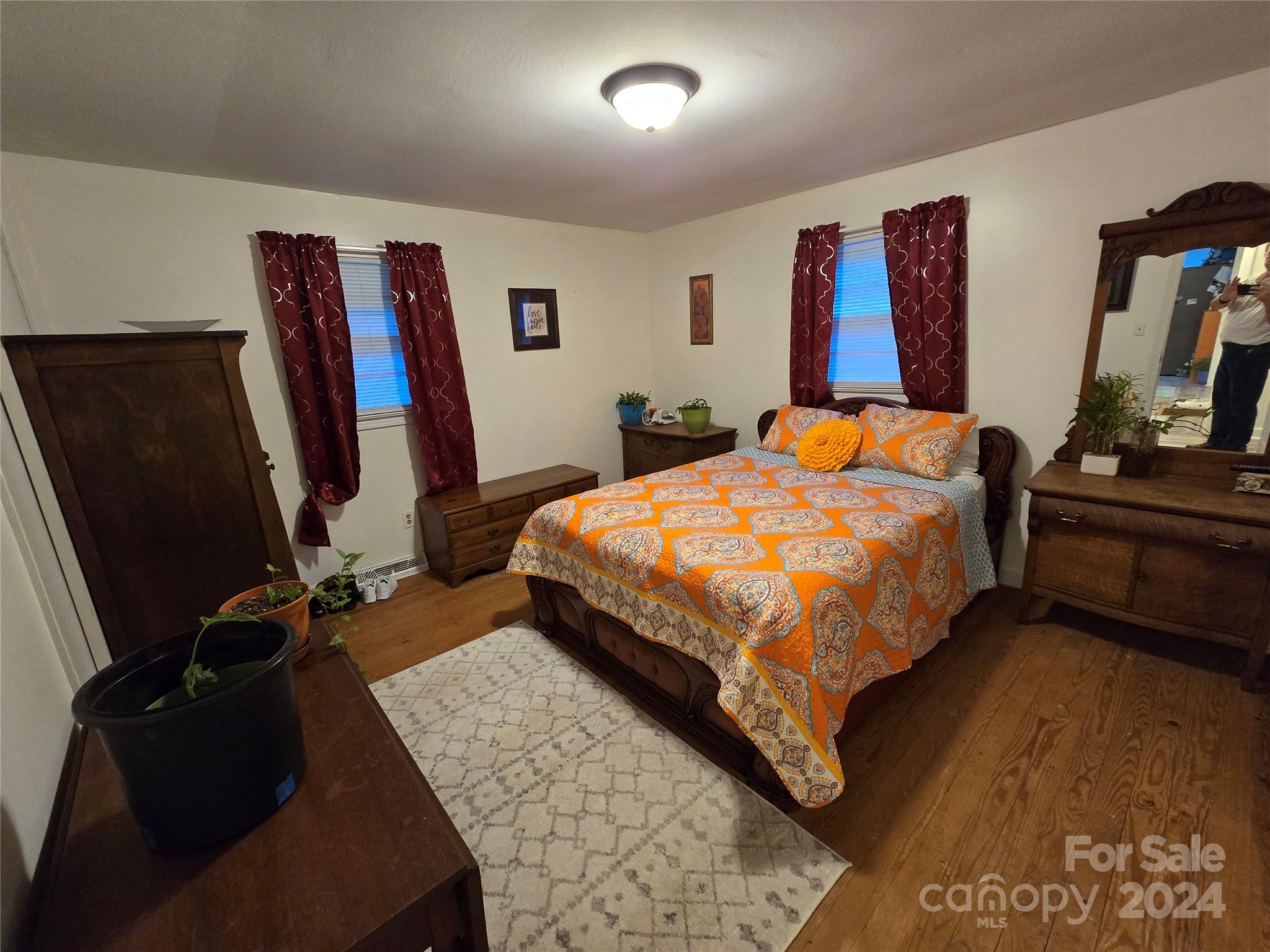 206 Fallen Oaks Lane Rutherfordton, NC 28139 - Photo 23 of 26 a bedroom with a bed and a flat screen tv