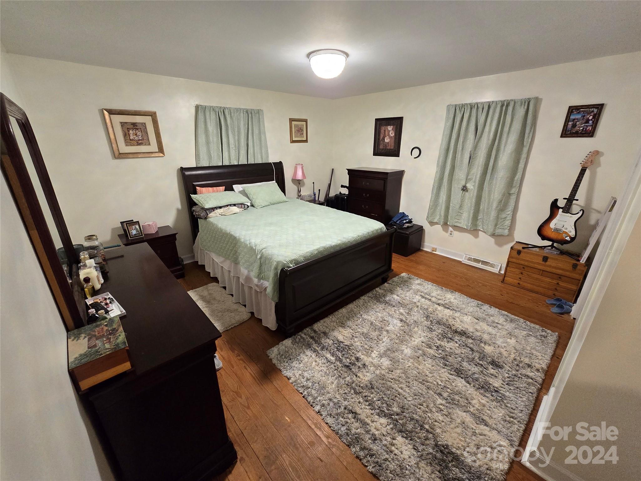 206 Fallen Oaks Lane Rutherfordton, NC 28139 - Photo 24 of 26 a bedroom with a bed and a dresser