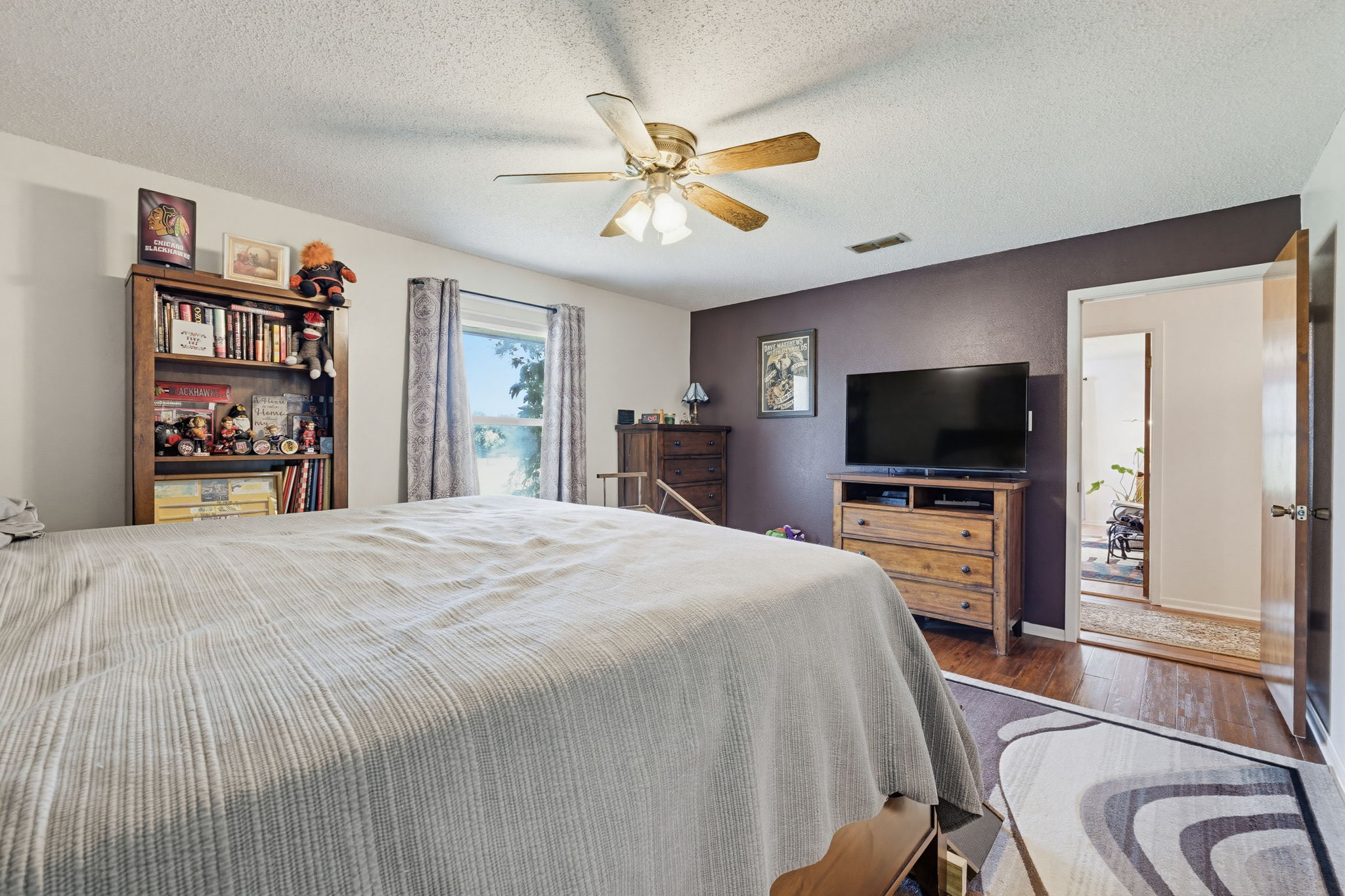 120 Rae Lane Jarrell, TX 76537 - Photo 35 of 40 Spacious room featuring wood-finish flooring, a ceiling fan, and a window with exterior views