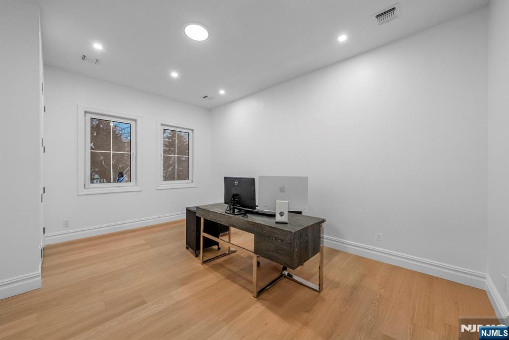 472 High Street Closter, NJ 07624 - Photo 11 of 34 a view of a workspace with furniture and a window