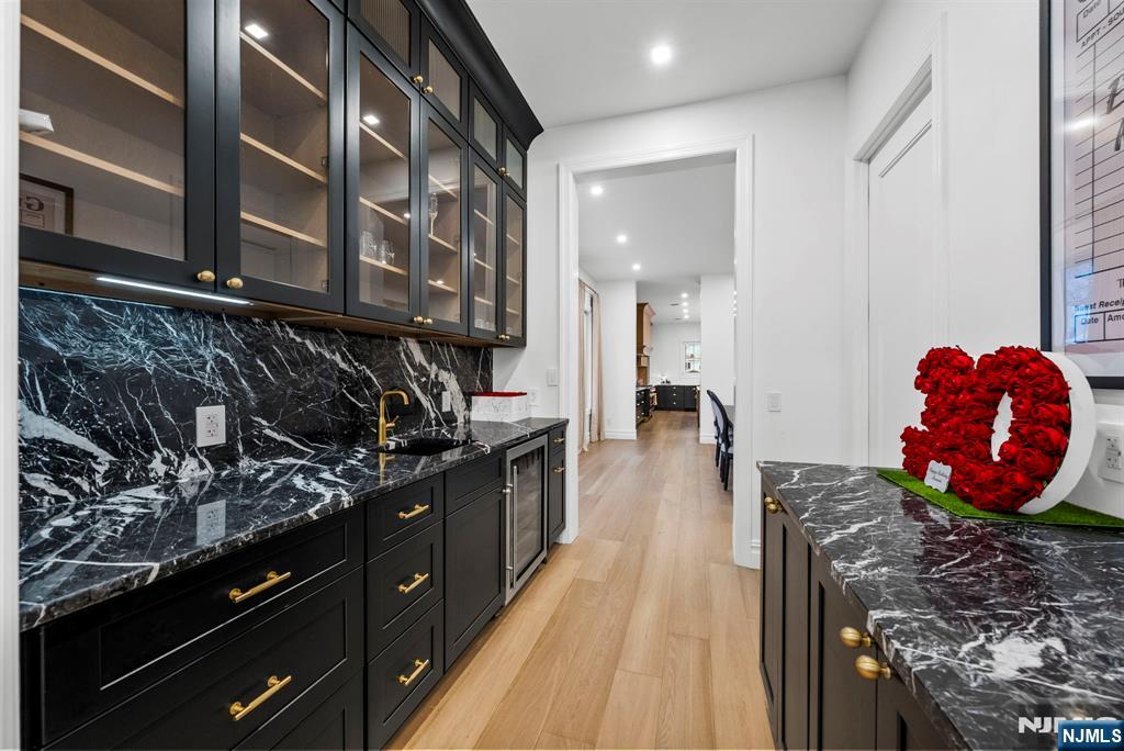 472 High Street Closter, NJ 07624 - Photo 14 of 38 a kitchen with stainless steel appliances granite countertop a stove and cabinets